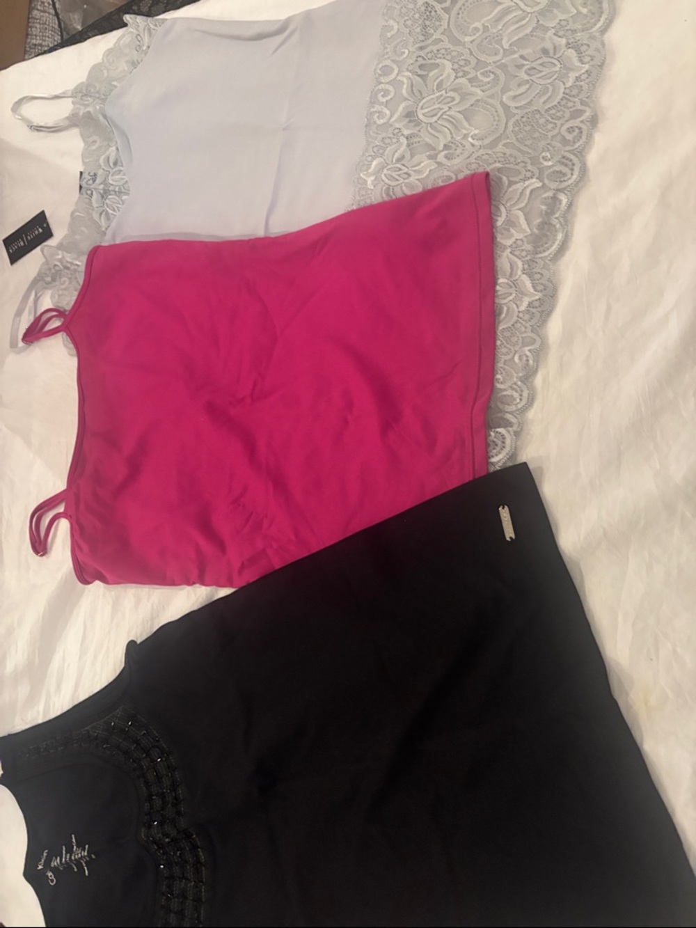 Three topsCalvin Klein Black Beaded Scoop Tank,two black and white tops.